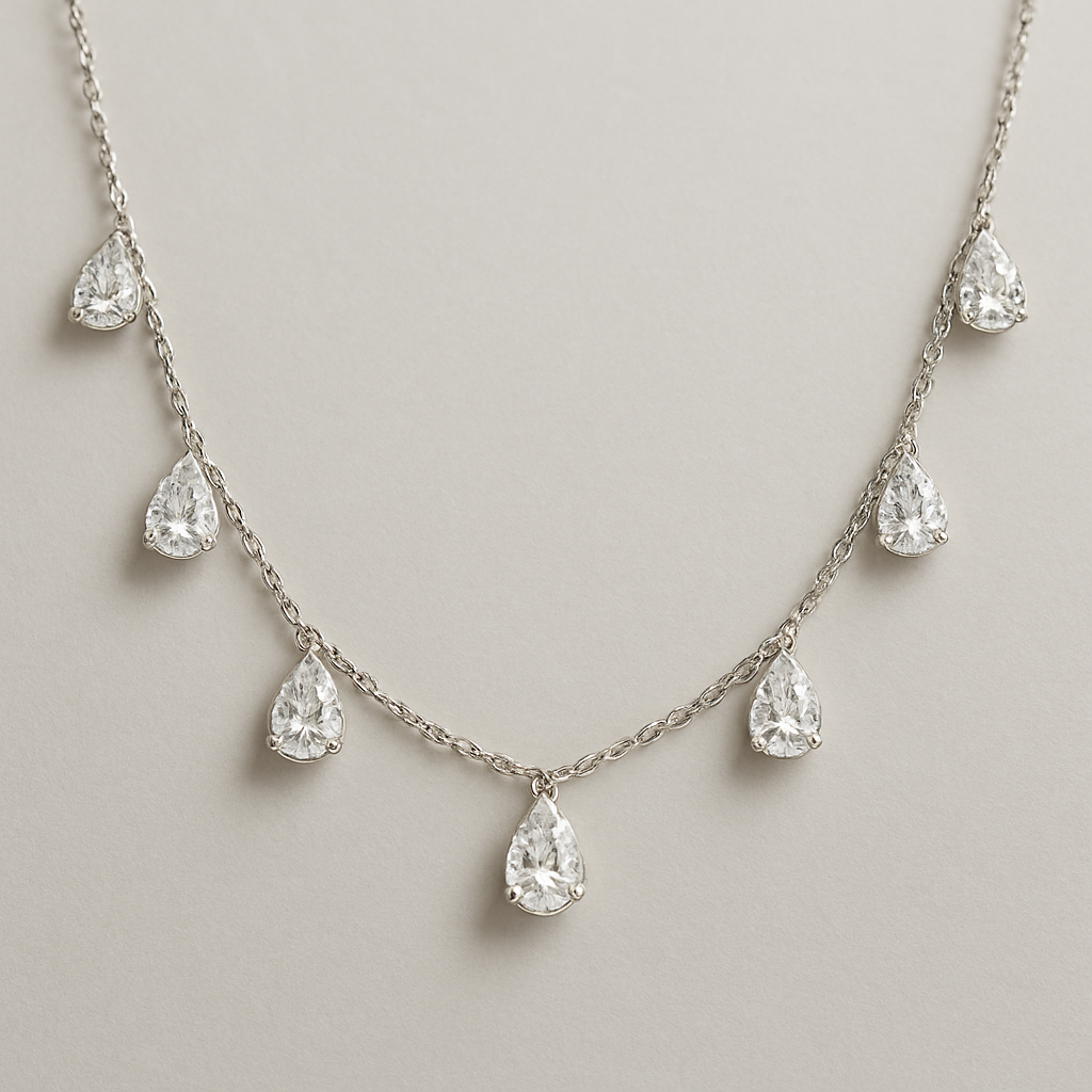 Pear shape pears station necklace 7 diamonds each diamonds .15 no bezel