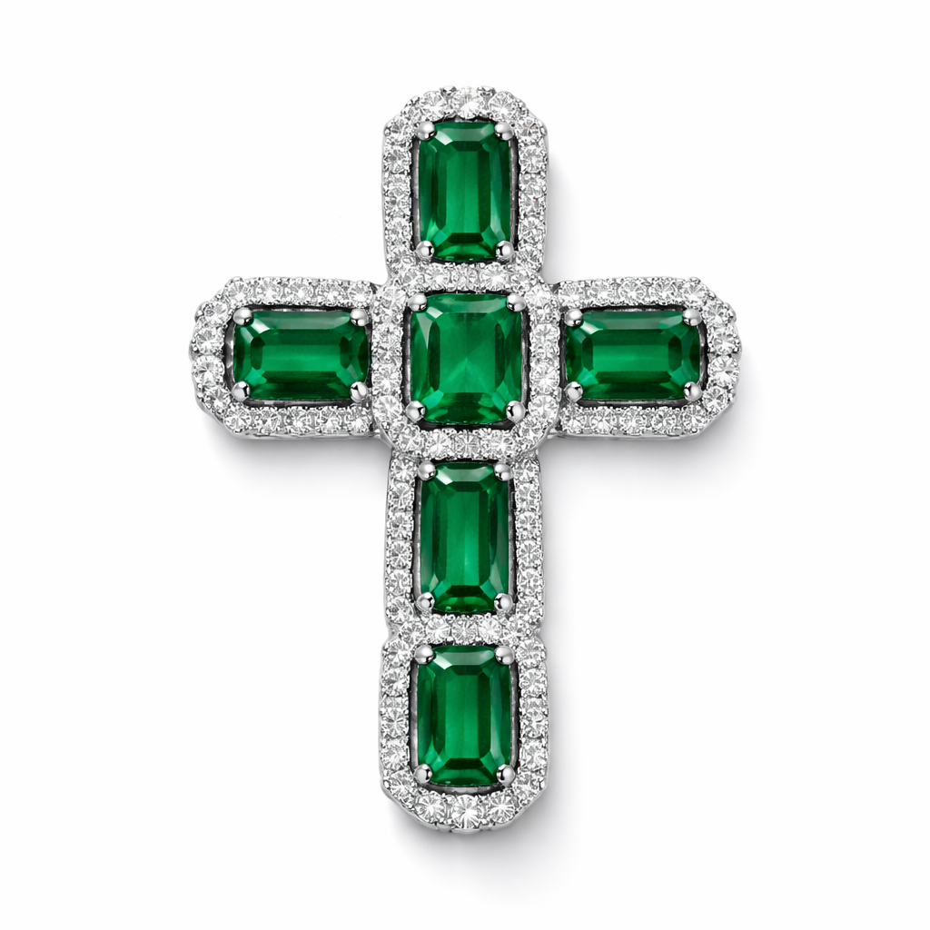 Emerald white gold cross and with simple diamond accent stones. Timeless, elegant, and classy. Hidden bail.