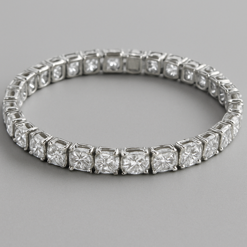 Diamond tennis bracelet set with oval, round and square shaped diamonds All the same size just a different shape Dense as silver One carat each diamond