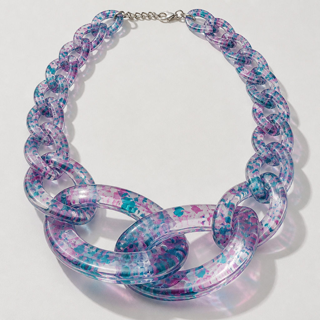 A women's necklace. create a chunky Cuban Link style plastic chain that is o graduated and exaggerated in the first front three links that is translucent confetti lucite of teal and pink
photorealistic jewelry design, A women's necklace. create a chunky Cuban Link style plastic chain that is o graduated and exaggerated in the first front three links that is translucent confetti lucite of teal and pink, modern style, just the design no text