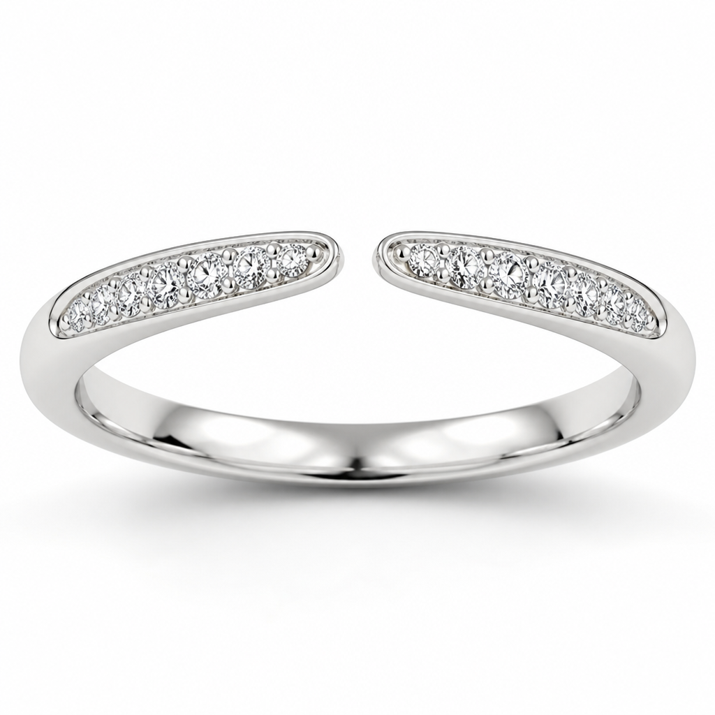 White gold wedding band that tapers with an opening at the top. Symmetrical diamonds on both sides of the taper