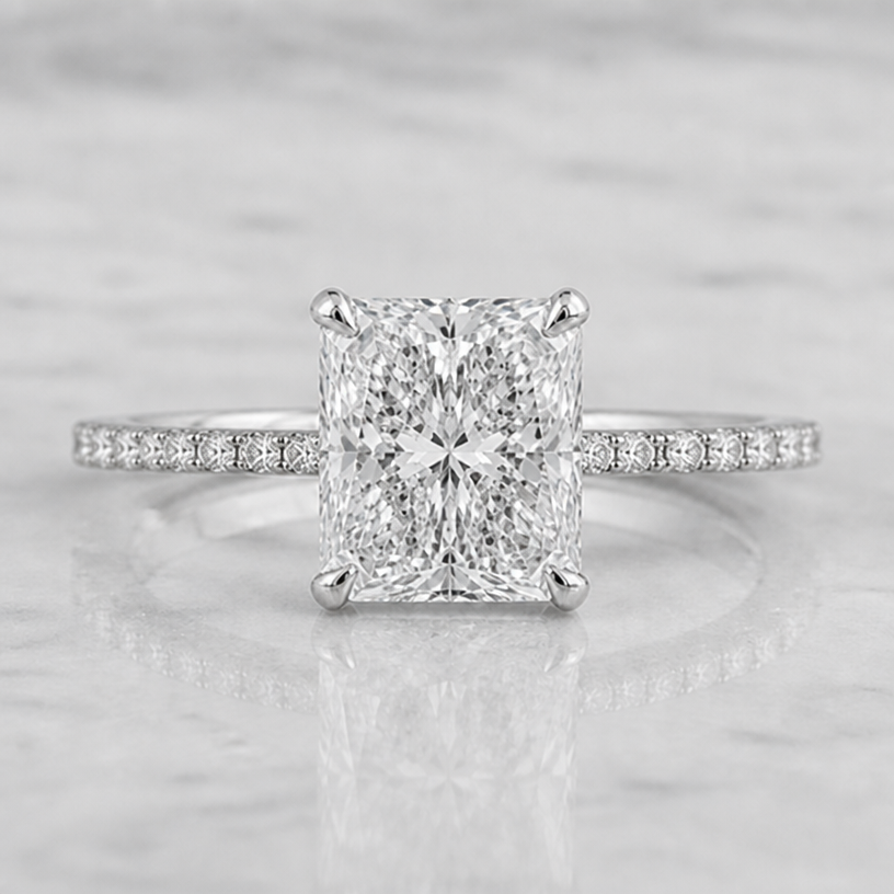 The diamonds on the band are slightly smaller and the main diamond is slightly more square
edit the attached jewelry design with these instructions: The diamonds on the band are slightly smaller and the main diamond is slightly more square. keep it photorealistic, just the design no text