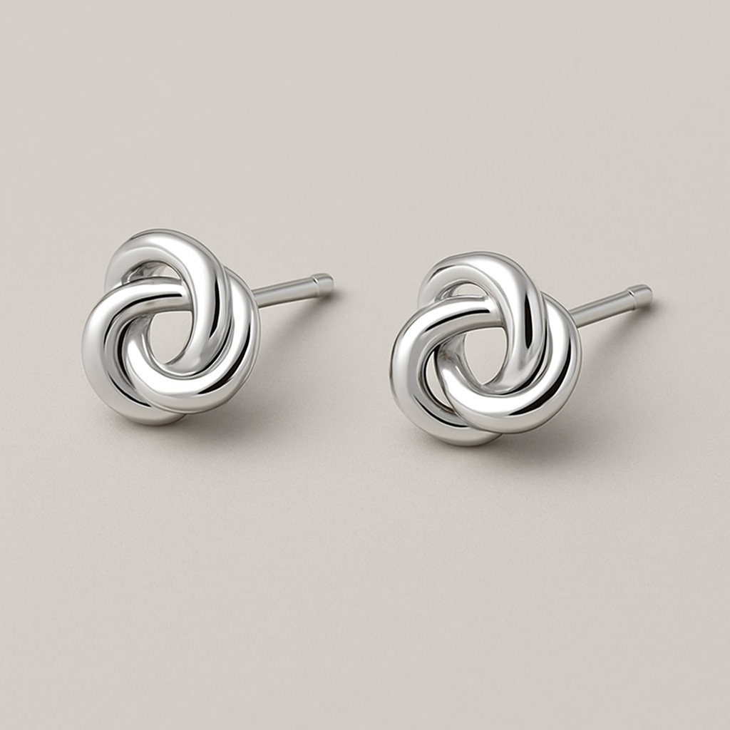 "Love's Knot" Stud Earrings: Elegant sterling silver stud earrings in the shape of a perfectly formed, simple love knot. No stones, just the beautiful, symbolic intertwining of silver.