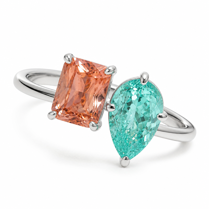 A minimalist women's ring made of white gold suitable for wedding, minimalist, simple and delicate, clean lines. Toi et Moi with rectangular Padparadsha coloured stone (10x8x5.5mm) & paraiba pear stone (14x9x6mm)
using the attached image as a visual reference, create A minimalist women's ring made of white gold suitable for wedding, minimalist, simple and delicate, clean lines. Toi et Moi with rectangular Padparadsha coloured stone (10x8x5.5mm) & paraiba pear stone (14x9x6mm). photorealistic, just the design no text