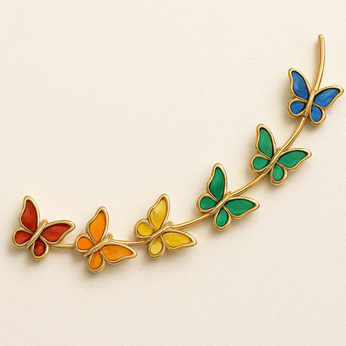 7 small butterflies on gold line, colored with each color: red, orange, yellow, green, blue and purple.