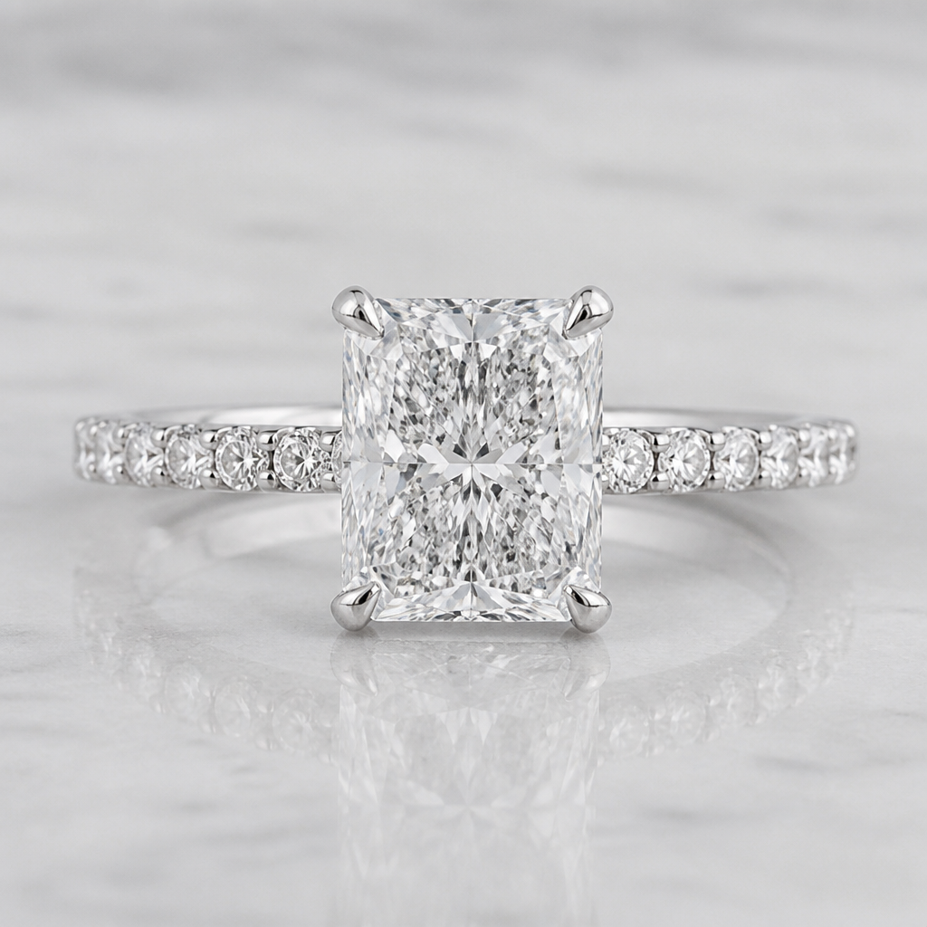 A white gold engagement ring. The band is all a single line of small diamonds in a half eternity. The main stone is a four prong radiant cut that is a rectangle but close to a square. The main diamond looks like crushed ice the main diamond is 3 carat
photorealistic jewelry design, A white gold engagement ring. The band is all a single line of small diamonds in a half eternity. The main stone is a four prong radiant cut that is a rectangle but close to a square. The main diamond looks like crushed ice the main diamond is 3 carat , modern style, just the design no text