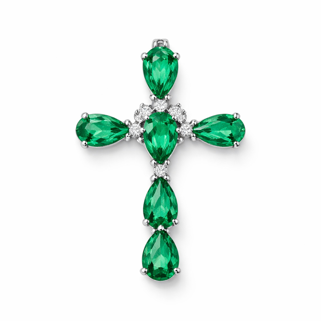 Pear cut Emerald white gold cross and with simple diamond accent stones. Timeless, elegant, and classy. Hidden bail. Light metal work. No double prongs