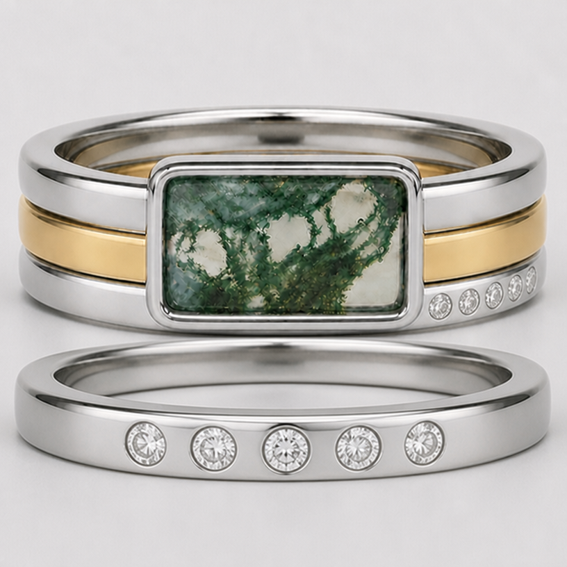 Add another band (so there are three with the solitaire and one separate from the other three) in white gold with five, round, flush set diamonds on top.