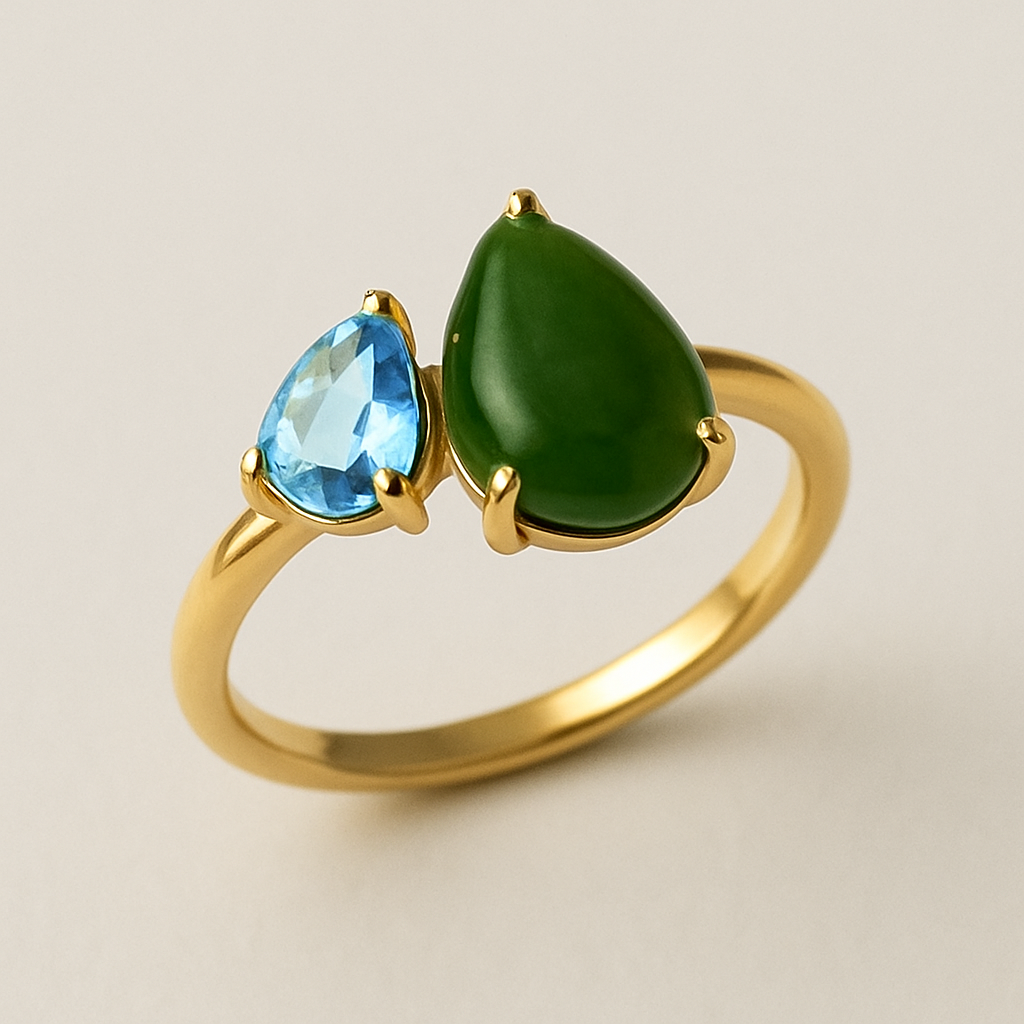 Toi et Moi Ring with a small pear shaped blue topaz and a slightly larger pear shaped nephrite jade stone