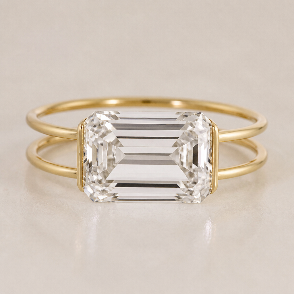 A 10ct emerald cut clear diamond that is east west on a ring. The ring is double banded and the bands are extremely thin and a quarter inch apart. There is half bezel, only on the east and west sides of the stone. The bezel part is extremely thin almost inconspicuous. The stone hangs over the bands on the top and bottom. All of the metal is yellow gold
photorealistic jewelry design, A 10ct emerald cut clear diamond that is east west on a ring. The ring is double banded and the bands are extremely thin and a quarter inch apart. There is half bezel, only on the east and west sides of the stone. The bezel part is extremely thin almost inconspicuous. The stone hangs over the bands on the top and bottom. All of the metal is yellow gold , minimalist style, just the design no text