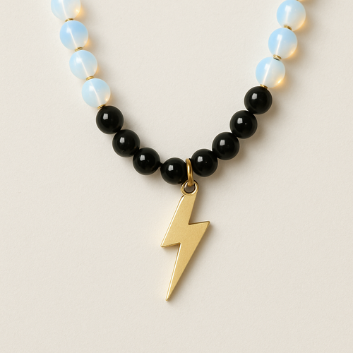 Opalite and onyx necklace with a gold lightening strike pendent