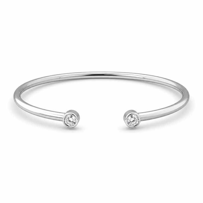 A women's bracelet made of silver, minimalist, simple and delicate, clean lines. a 3mm round wire with 2 stone ingraved at the 2 ends of the bracelet
using the attached image as a visual reference, create A women's bracelet made of silver, minimalist, simple and delicate, clean lines. a 3mm round wire with 2 stone ingraved at the 2 ends of the bracelet. photorealistic, just the design no text