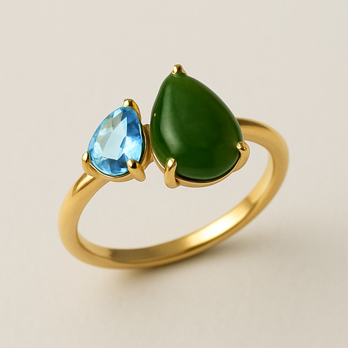 Toi et Moi Ring with a small pear shaped blue topaz and a slightly larger pear shaped nephrite jade stone