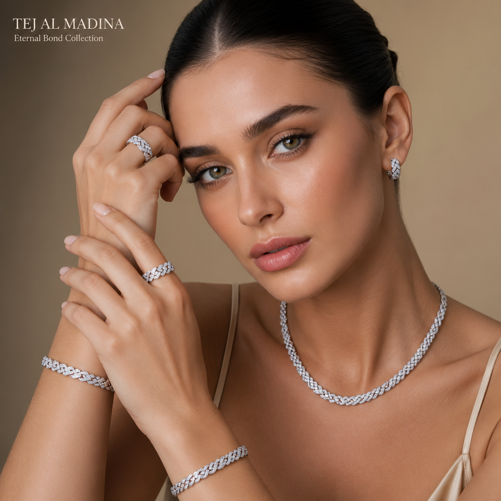 A women's ring. Create a high-end luxury jewelry campaign using the uploaded product images.
Use the uploaded necklace, bracelets, rings, and earrings as the exact products (no redesign, no shape modification, preserve all original details and proportions).
Apply them naturally on a professional female model in a high fashion editorial style.
Model: elegant, symmetrical face, high cheekbones, refined jawline, flawless luminous skin, hazel eyes with subtle green-gold-brown tones, calm and sophisticated expression.
Hair: sleek, dark, pulled back, minimal styling.
Jewelry: ensure all pieces form a cohesive matching set, perfectly aligned and visible.
Earrings subtle but visible, rings clearly shown on fingers, bracelets on wrists, necklace centered on neck.
Metal: platinum finish (cool-toned, slightly darker than silver, mirror-polished, dense luxury feel, realistic reflections).
Preserve real material appearance from uploaded images.
Lighting: soft diffused studio lighting, high-end jewelry lighting setup, controlled reflections, soft shadows, premium glow on skin and metal.
Background: minimal luxury beige or soft neutral gradient, clean and elegant.
Composition: close-up portrait with hands near face to highlight rings and bracelets, balanced framing, focus on jewelry and face harmony.
Branding:
Replace any existing text with: "TEJ AL MADINA"
Add in corner in luxury serif font: TEJ AL MADINA
Add below: "Eternal Bond Collection"
Minimal, refined, editorial layout (Vogue-style but no external brand names).
Quality: ultra realistic, 8K, sharp focus, shallow depth of field, luxury campaign, global high jewelry brand aesthetic.
Priority: product fidelity first, no distortion, no redesign, accurate placement of uploaded jewelry.
photorealistic jewelry design, A women's ring. Create a high-end luxury jewelry campaign using the uploaded product images.
Use the uploaded necklace, bracelets, rings, and earrings as the exact products (no redesign, no shape modification, preserve all original details and proportions).
Apply them naturally on a professional female model in a high fashion editorial style.
Model: elegant, symmetrical face, high cheekbones, refined jawline, flawless luminous skin, hazel eyes with subtle green-gold-brown tones, calm and sophisticated expression.
Hair: sleek, dark, pulled back, minimal styling.
Jewelry: ensure all pieces form a cohesive matching set, perfectly aligned and visible.
Earrings subtle but visible, rings clearly shown on fingers, bracelets on wrists, necklace centered on neck.
Metal: platinum finish (cool-toned, slightly darker than silver, mirror-polished, dense luxury feel, realistic reflections).
Preserve real material appearance from uploaded images.
Lighting: soft diffused studio lighting, high-end jewelry lighting setup, controlled reflections, soft shadows, premium glow on skin and metal.
Background: minimal luxury beige or soft neutral gradient, clean and elegant.
Composition: close-up portrait with hands near face to highlight rings and bracelets, balanced framing, focus on jewelry and face harmony.
Branding:
Replace any existing text with: "TEJ AL MADINA"
Add in corner in luxury serif font: TEJ AL MADINA
Add below: "Eternal Bond Collection"
Minimal, refined, editorial layout (Vogue-style but no external brand names).
Quality: ultra realistic, 8K, sharp focus, shallow depth of field, luxury campaign, global high jewelry brand aesthetic.
Priority: product fidelity first, no distortion, no redesign, accurate placement of uploaded jewelry., modern style, just the design no text