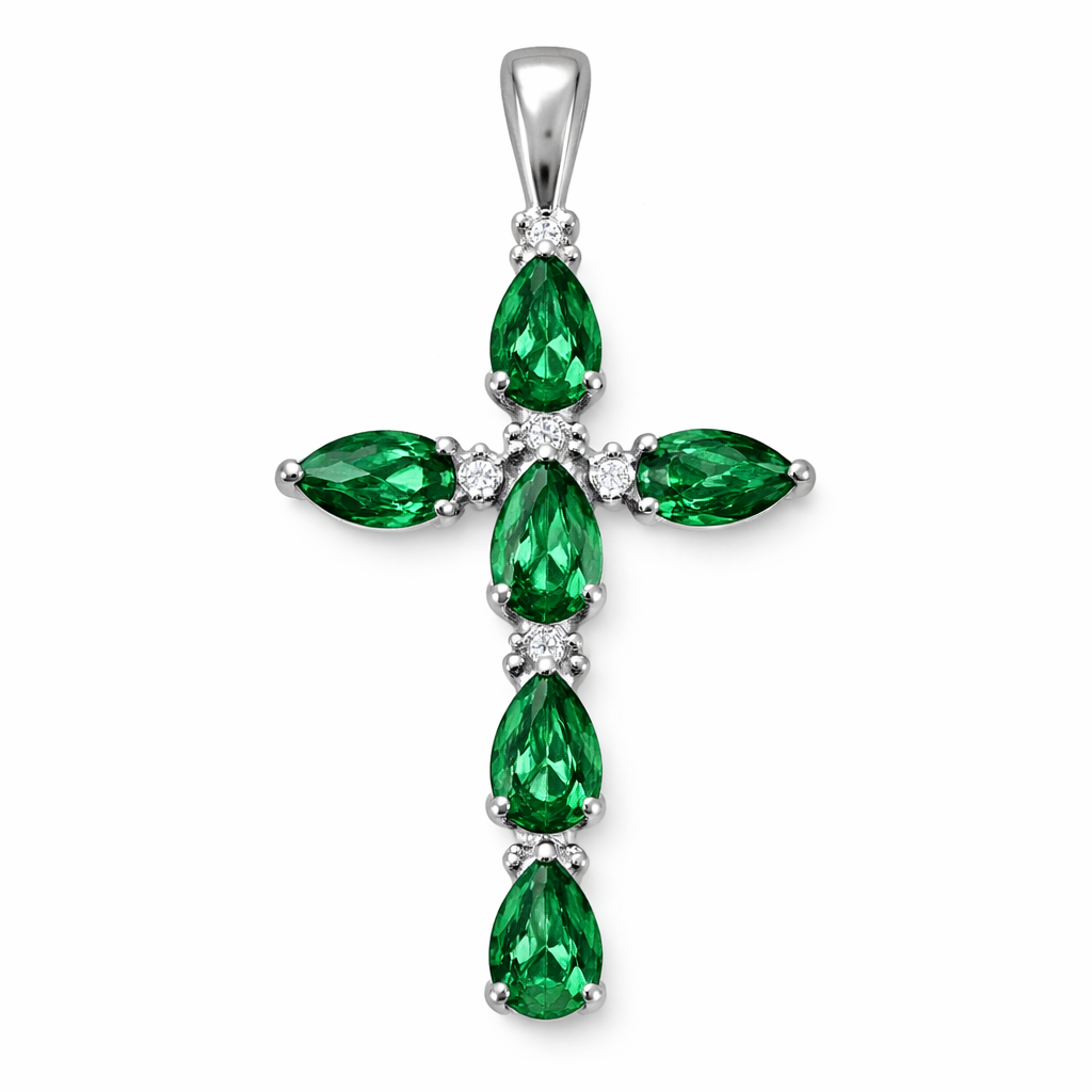 Faceted pear cut emerald white gold cross with 2 small diamond accent stones in between each emerald. White gold bale with no diamonds.
