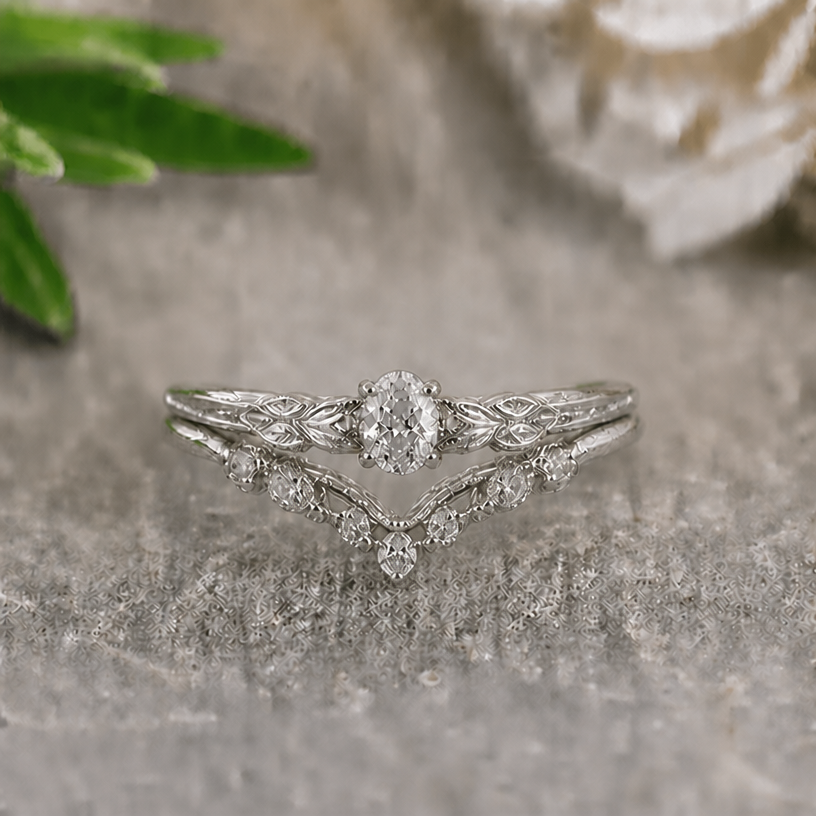 Make the lower ring more v shaped, keep all other details
edit the attached jewelry design with these instructions: Make the lower ring more v shaped, keep all other details. keep it photorealistic, just the design no text