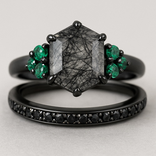 Black band, medium long hexagon cut rutilated black quartz, emerald accent stones 3 on each side in a cluster, add a wedding band with black stones