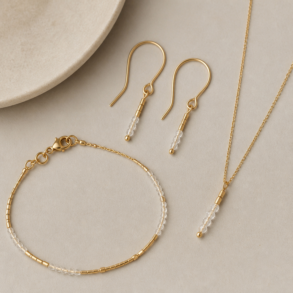 A scandinavian women's earrings made of gold suitable for daily wear, ultra-minimalist, very simple and clean, understated, no embellishments. made from wire, seed beads and crystal beads a set of earrings with matching bracelet and necklace
photorealistic jewelry design, A scandinavian women's earrings made of gold suitable for daily wear, ultra-minimalist, very simple and clean, understated, no embellishments. made from wire, seed beads and crystal beads a set of earrings with matching bracelet and necklace, scandinavian style, just the design no text