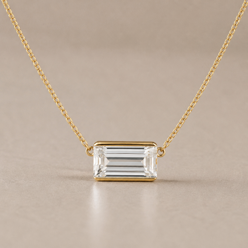 10ct emerald cut diamond pendant that can be placed on different chains. It has a small loop to thread chains through. The diamond is east west. Can show it on a 14inch necklace. All of the metal is yellow gold. Half bezel not prongs. Bezel is thin and only on east west sides
photorealistic jewelry design, 10ct emerald cut diamond pendant that can be placed on different chains. It has a small loop to thread chains through. The diamond is east west. Can show it on a 14inch necklace. All of the metal is yellow gold. Half bezel not prongs. Bezel is thin and only on east west sides , minimalist style, just the design no text