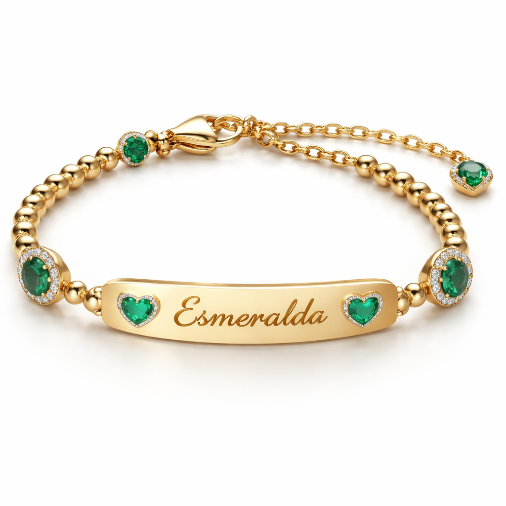 A women's ring. pulsera de bebe con esmeraldas y oro y placa q diga esmeralda