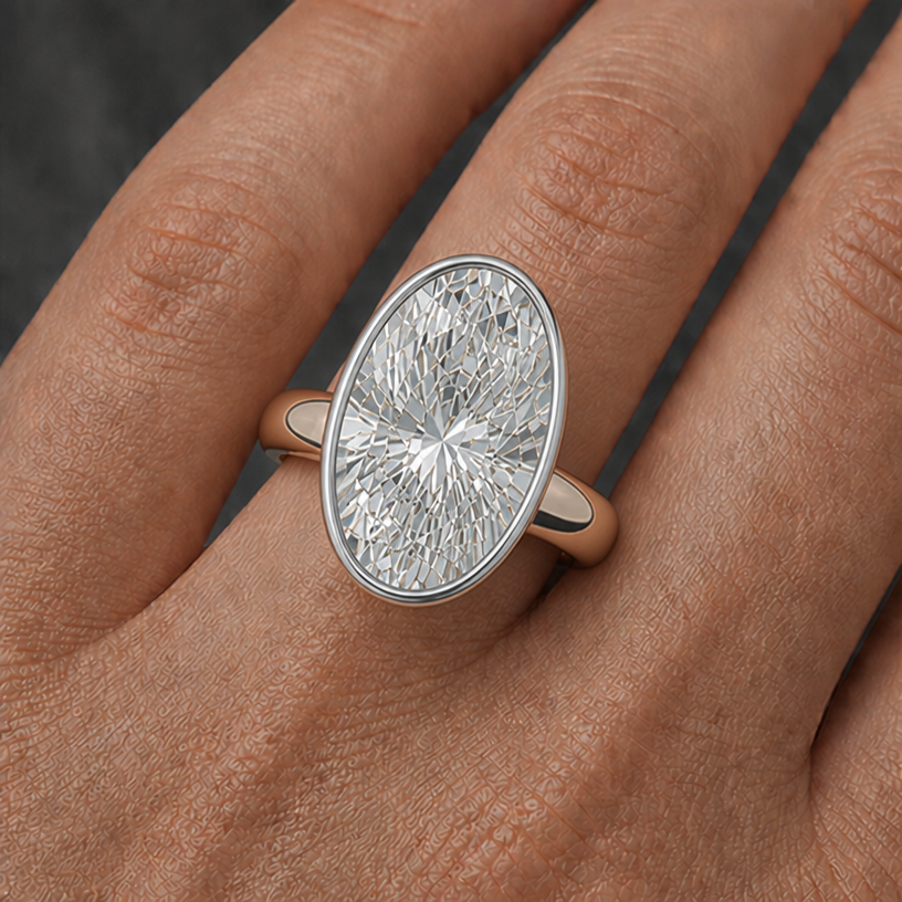 4mm rose gold band, 16mm x 11mm oval diamond bezel design platinum
edit the attached jewelry design with these instructions: 4mm rose gold band, 16mm x 11mm oval diamond bezel design platinum. keep it photorealistic, just the design no text