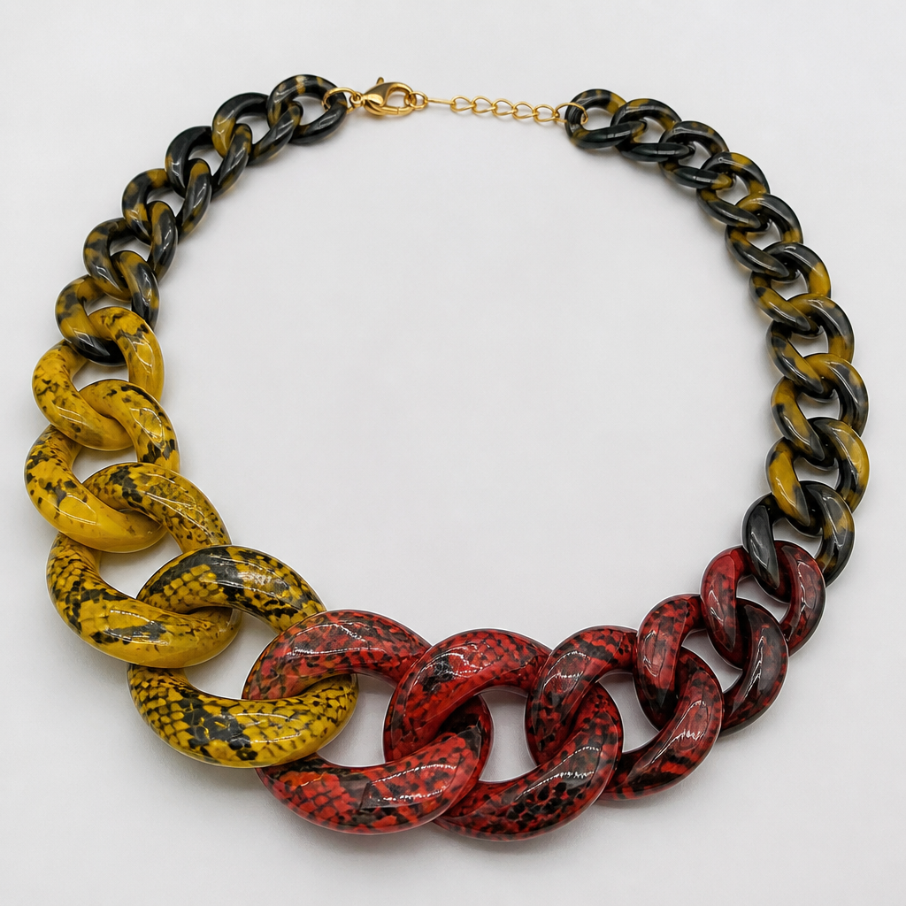 A women's necklace. create a chunky Cuban links style plastic necklace that is graduated and exaggerated in the first three links of colors inspired by poisonous snakes
photorealistic jewelry design, A women's necklace. create a chunky Cuban links style plastic necklace that is graduated and exaggerated in the first three links of colors inspired by poisonous snakes, modern style, just the design no text