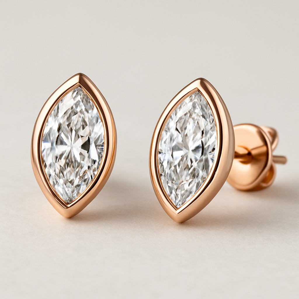A marquis stude earrings with rose gold bazl
