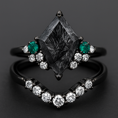 Kite cut Black rutilated quartz with 1 emerald on each side and 3 moissanite on each side accent stones in a cluster on a black band, separate wedding band black with moissanite stones that curves around the main stone 