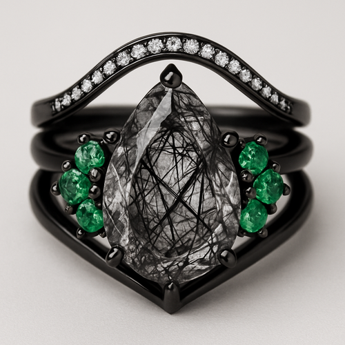 Black band, long kite cut rutilated black quartz, emerald accent stones 3 on each side in a cluster, add a wedding band that curves around the top of the main stone with black and white stones