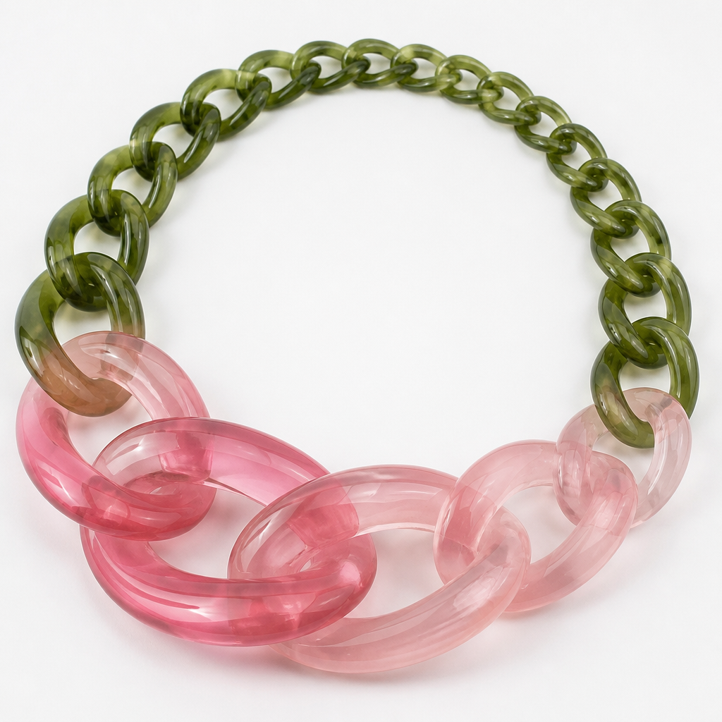 A women's ring. create a chunky Cuban links style plastic necklace that is graduated and exaggerated in the first three links of translucent colors with the back part being green like a flower stem and the front part being a rose color
photorealistic jewelry design, A women's ring. create a chunky Cuban links style plastic necklace that is graduated and exaggerated in the first three links of translucent colors with the back part being green like a flower stem and the front part being a rose color, modern style, just the design no text