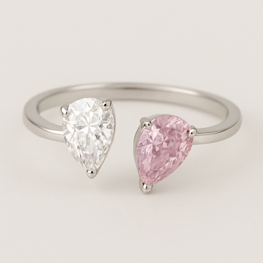 Design a toi ET moi with two pear shaped diamonds. Make them 1ct big and one of them pink diamons