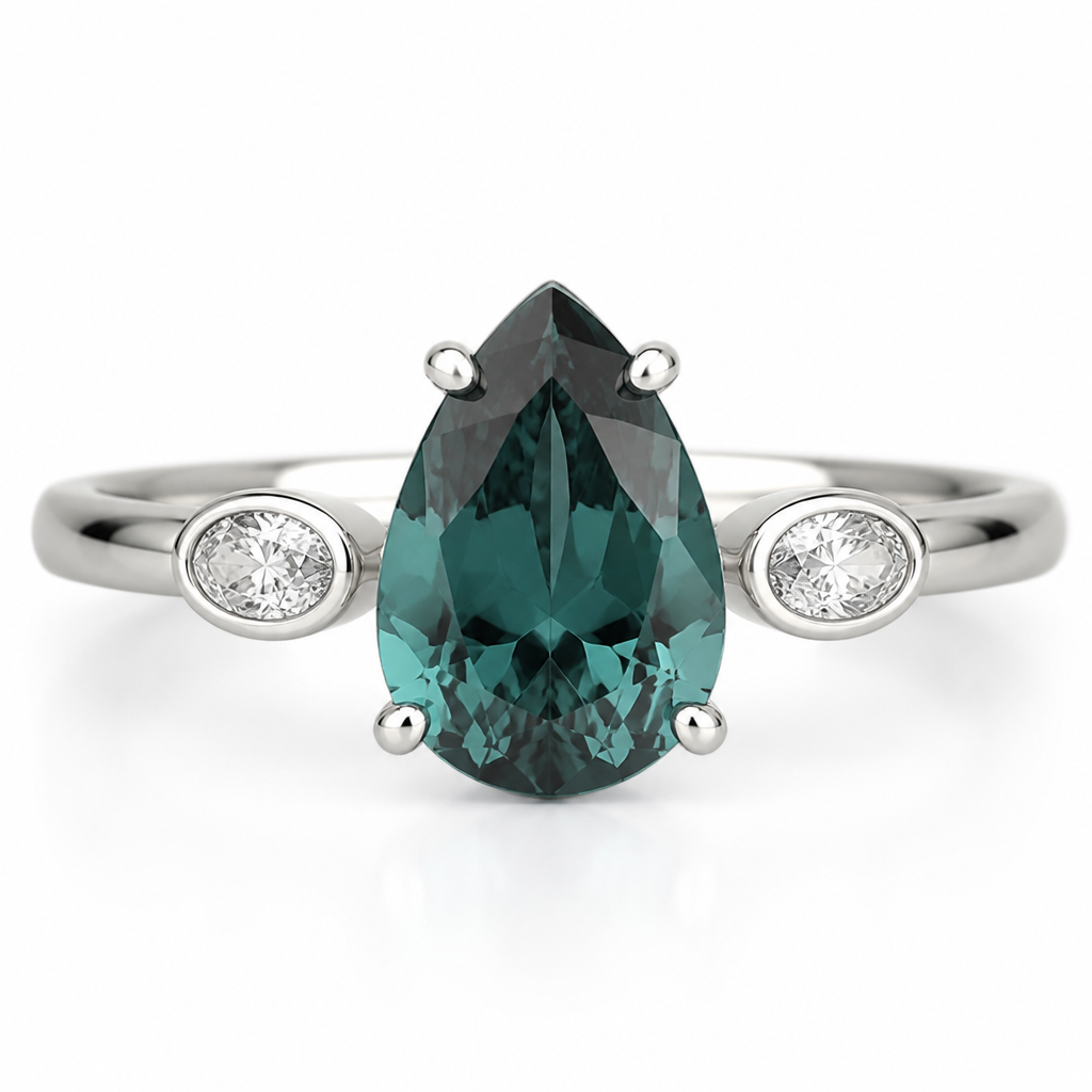 engagement ring in 14k white gold with a pear shaped teal stone in four prongs in the center. On the sides of the center stone are two 4x3 bezel set oval diamonds set sideway on the band on each side. the rest of the band is half round polished white gold.
photorealistic jewelry design, just the design, no text, 14k white gold engagement ring with a pear-shaped teal stone in four prongs. Two bezel-set oval diamonds sit sideways on the band on each side. The rest of the band is half-round polished white gold.