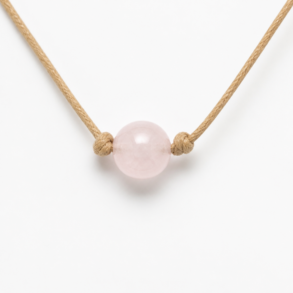 A minimalist pet necklace, featuring a transparent 12mm round rose quartz bead, hanging on a natural hemp rope tied with a simple knot. Hyper-realistic jewelry photography, pure white background, soft and even natural light, high resolution, detailed, 1:1 aspect ratio.
Minimalist jewelry: A minimalist pet necklace, 12mm clear rose quartz bead, simple knot natural hemp rope. Hyper-realistic jewelry photograph, pure white background, soft natural light, high resolution, detailed, 1:1 aspect ratio.
