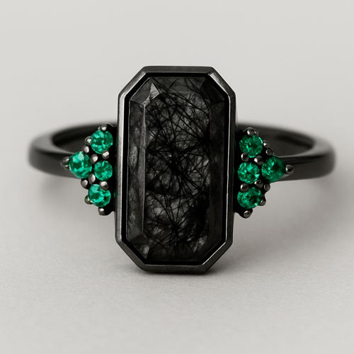 Black band, medium long hexagon cut rutilated black quartz, emerald accent stones 3 on each side in a cluster, second band that compliments