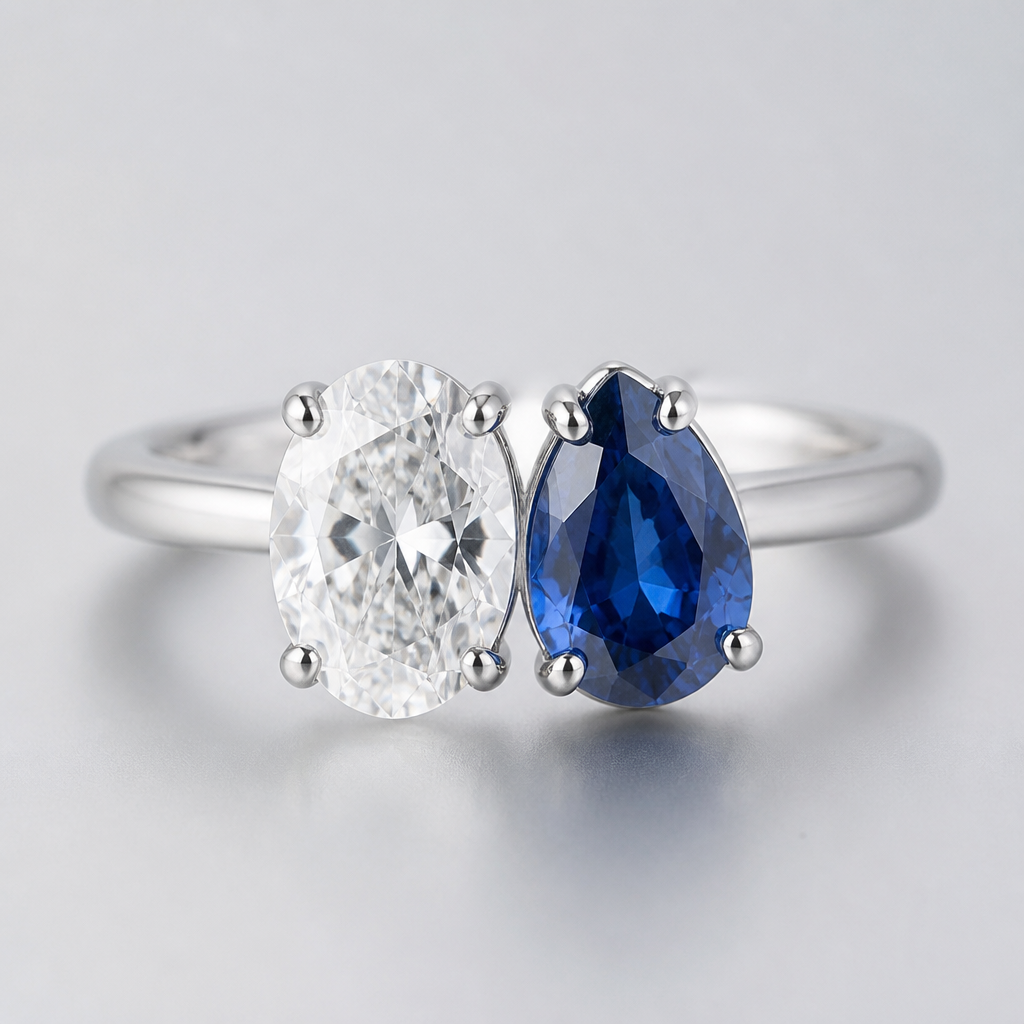 A sterling silver ring toi et moi style. Two stones. 1.46 carat oval white clear diamond on the left and 1.61 carat pear cut blue sapphire on the right
photorealistic jewelry design, A sterling silver ring toi et moi style. Two stones. 1.46 carat oval white clear diamond on the left and 1.61 carat pear cut blue sapphire on the right , minimalist style, just the design no text