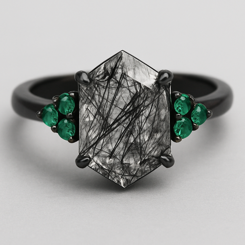 Black band, medium long hexagon cut rutilated black quartz, emerald accent stones 3 on each side in a cluster 