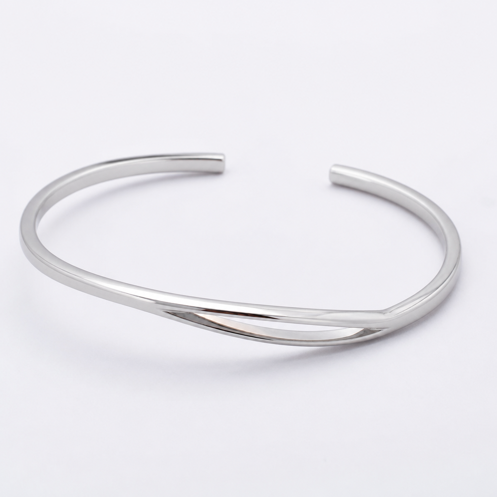 A women's bracelet made of silver. 2mm*4.5mm cuff with italic slit
photorealistic jewelry design, A women's bracelet made of silver. 2mm*4.5mm cuff with italic slit, modern style, just the design no text