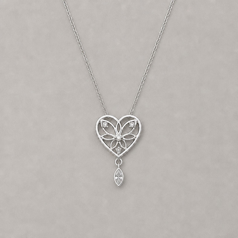 attacher en dessous du coeur un petit diamant marquise
edit the attached jewelry design with these instructions: attacher en dessous du coeur un petit diamant marquise. keep it photorealistic, just the design no text