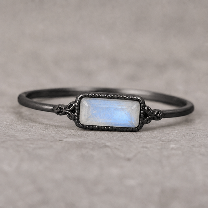Switch type of stone to a moonstone
edit the attached jewelry design with these instructions: Switch type of stone to a moonstone. keep it photorealistic, just the design no text